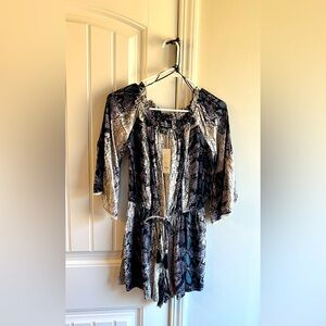 Francesca’s Jumpsuit/Romper; very cute and stylish. A must have item.